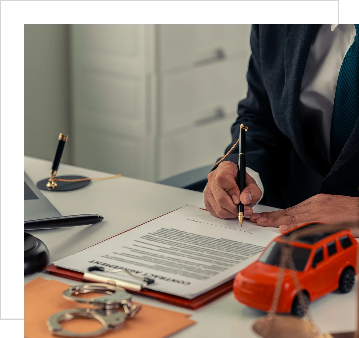 Signing contract on office desk